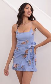 Picture thumb Capri Ruffle Tie Dress in Sky Blue Floral. Source: https://media.lucyinthesky.com/data/Apr21_1/170xAUTO/1V9A3113.JPG
