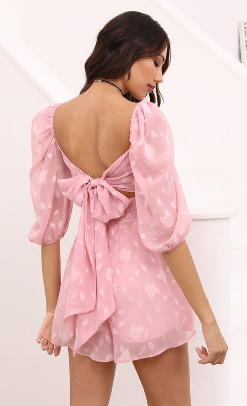 Picture Nora Puff Sleeve Floral Romper in Pink. Source: https://media.lucyinthesky.com/data/Apr21_1/500xAUTO/1V9A4485.JPG