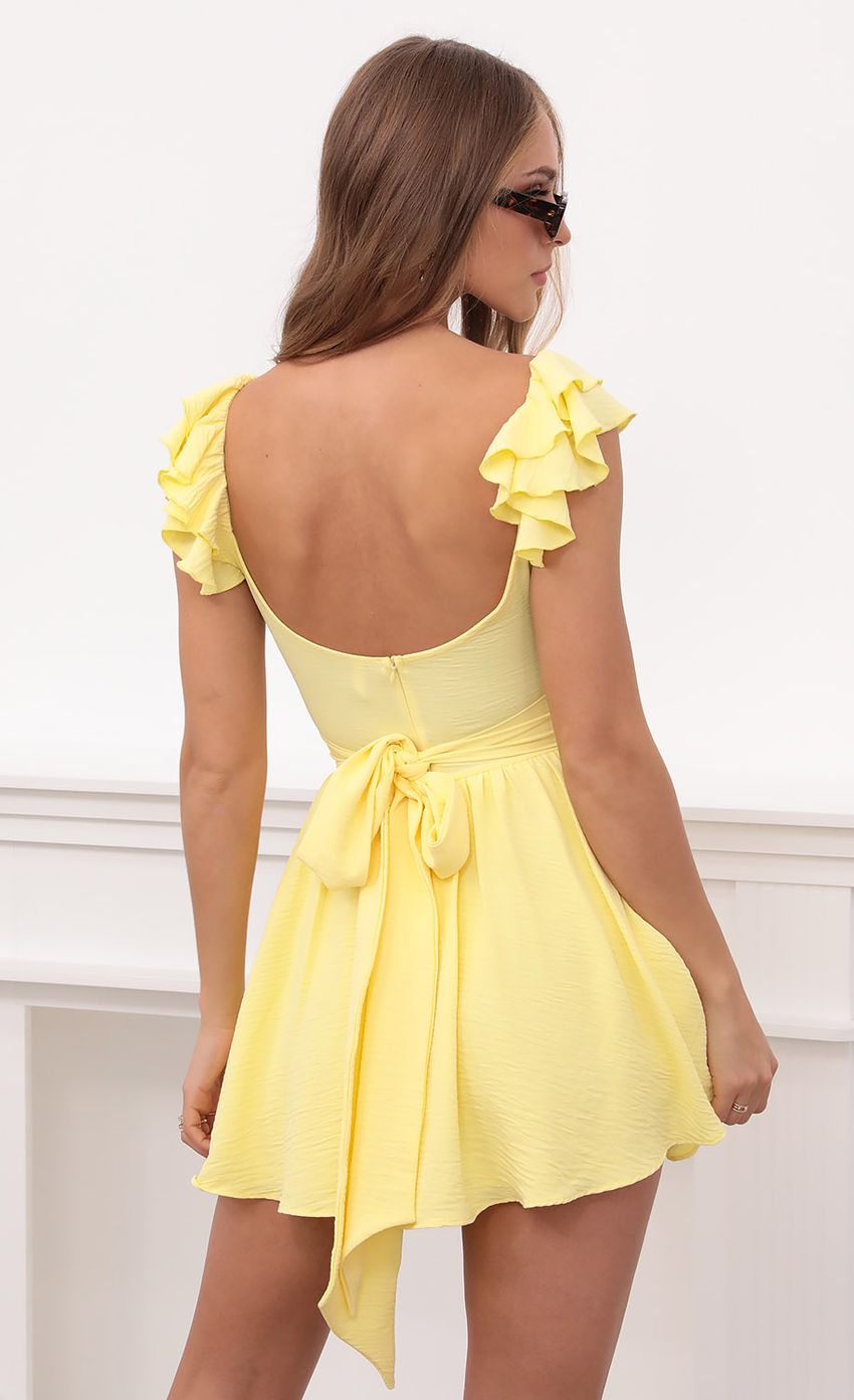 Picture Linnett Ruffle Sleeve Dress in Yellow. Source: https://media.lucyinthesky.com/data/Apr21_1/850xAUTO/1V9A6546.JPG