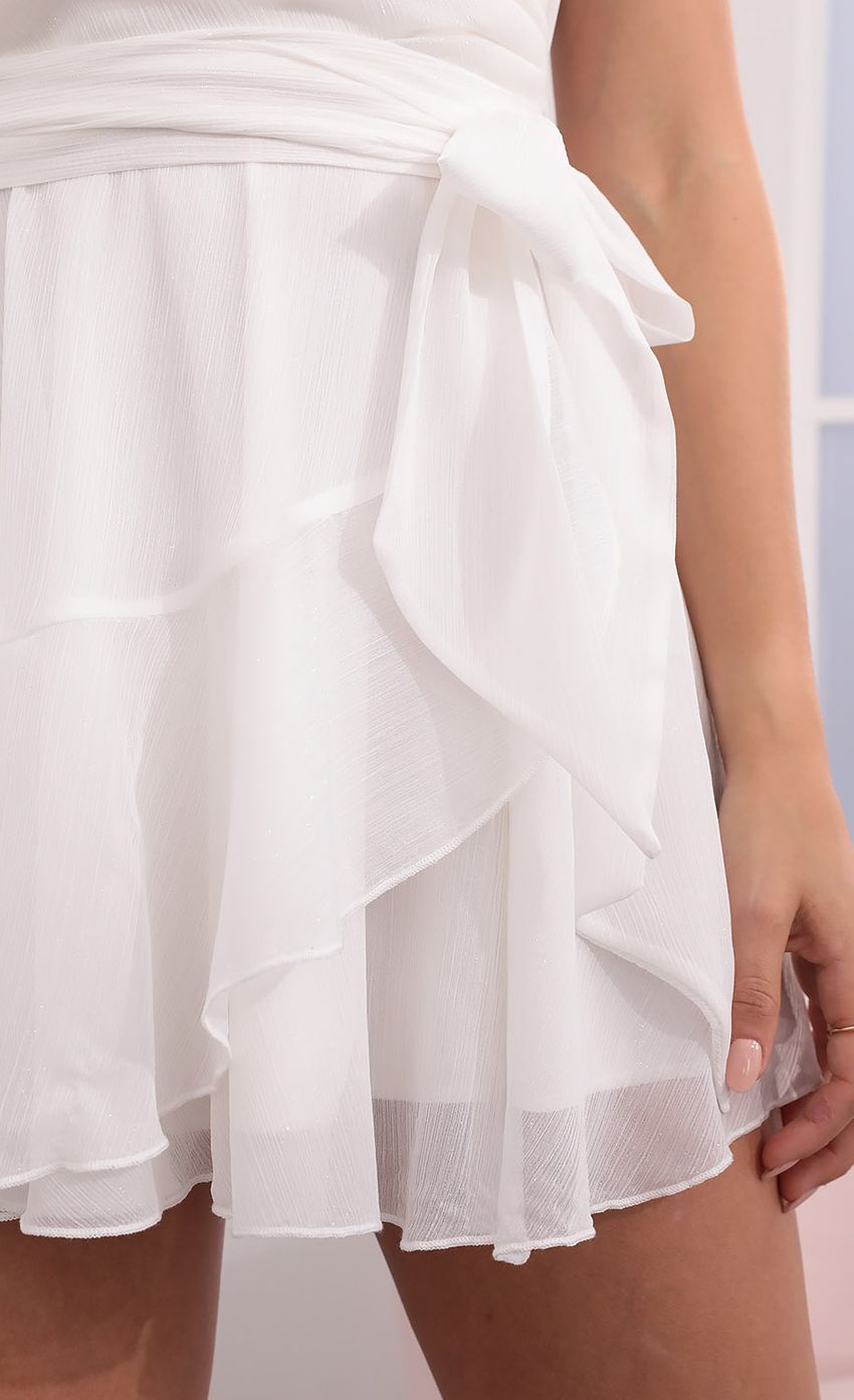 Picture Ava Wrap Dress in White Shimmer. Source: https://media.lucyinthesky.com/data/Apr21_1/850xAUTO/1V9A6757.JPG