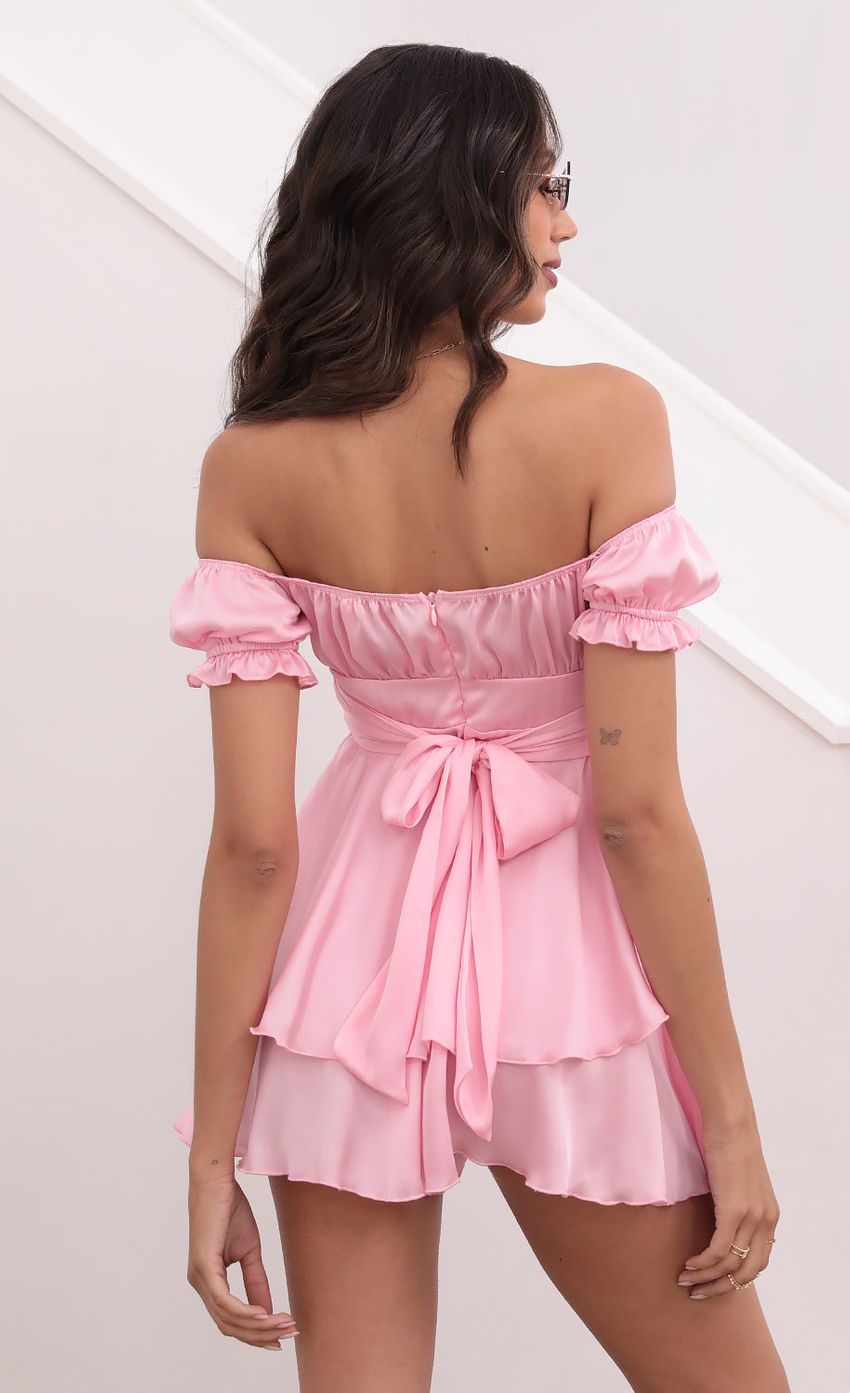 Picture Mariana Ruched Wrap Tie Romper in Satin Pink. Source: https://media.lucyinthesky.com/data/Apr21_2/850xAUTO/1V9A0090.JPG