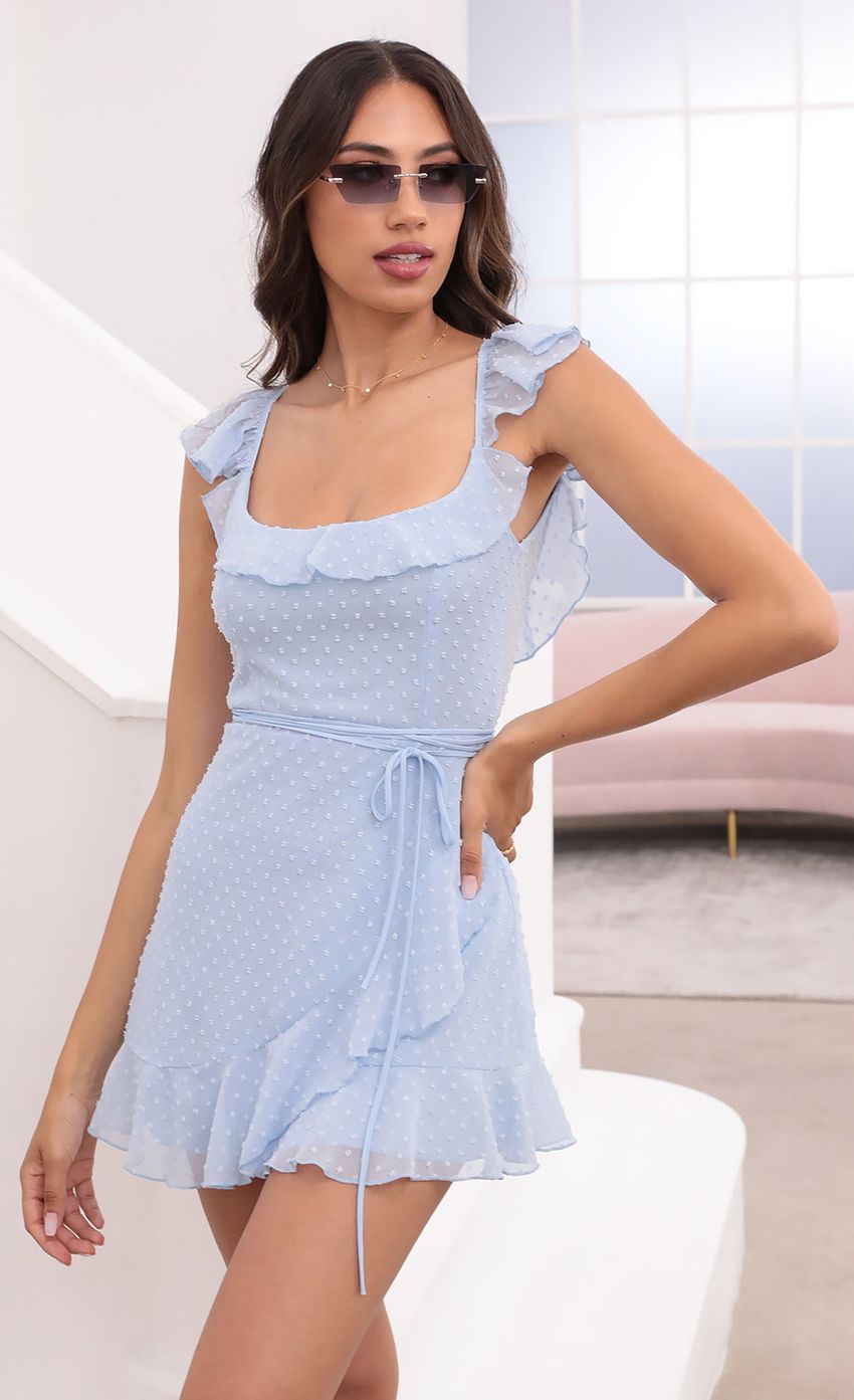 Picture Lini Wrap Dotted Chiffon Dress in Light Blue. Source: https://media.lucyinthesky.com/data/Apr21_2/850xAUTO/1V9A0994.JPG