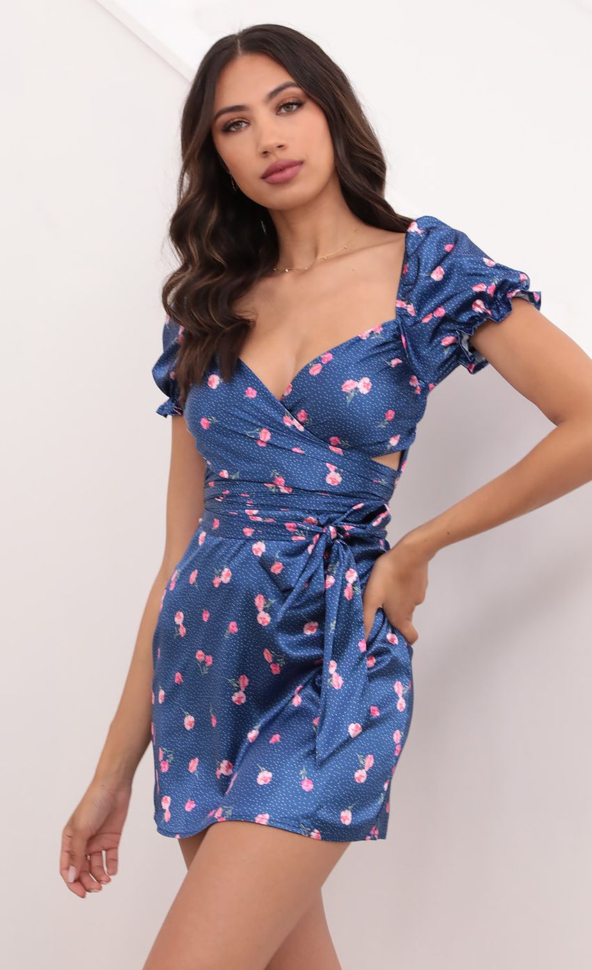 Picture Miley Puff Sleeve Satin Wrap Dress in Blue Floral. Source: https://media.lucyinthesky.com/data/Apr21_2/850xAUTO/1V9A2147.JPG