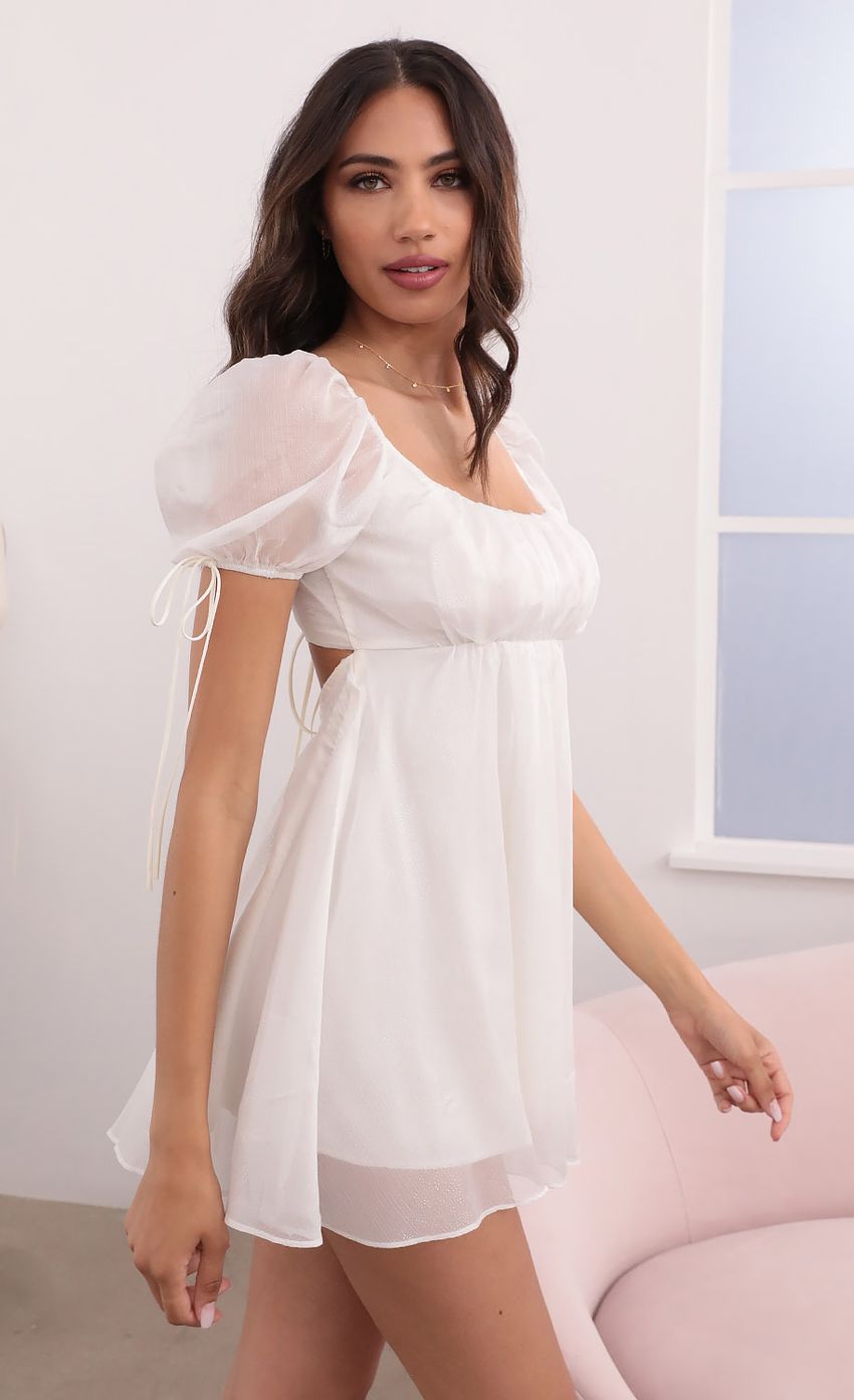 Picture Leilani Chiffon Shimmer Baby Doll Dress in White. Source: https://media.lucyinthesky.com/data/Apr21_2/850xAUTO/1V9A2389.JPG