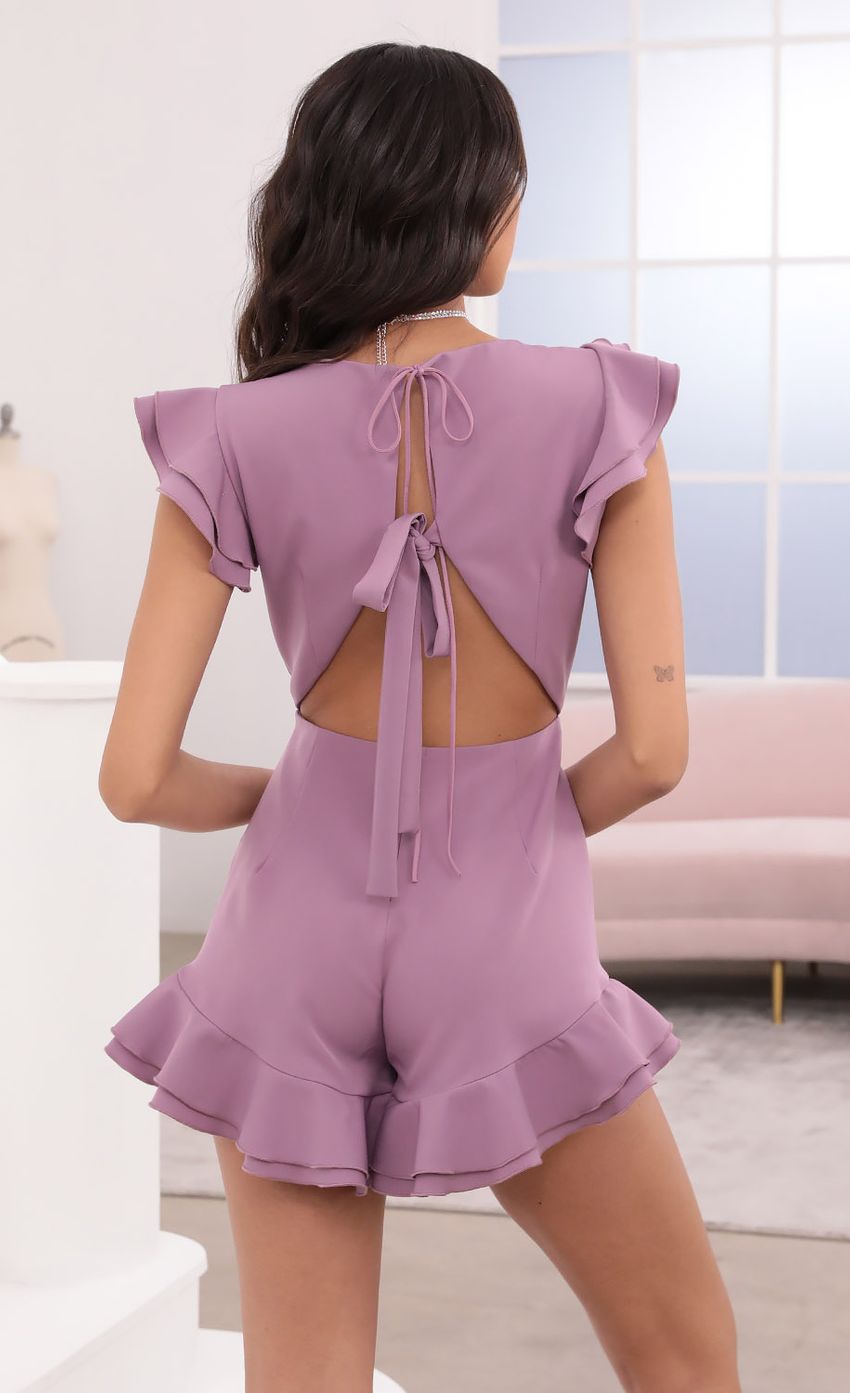 Picture Vitoria V-Neck Ruffle Romper in Mauve. Source: https://media.lucyinthesky.com/data/Apr21_2/850xAUTO/1V9A3844.JPG