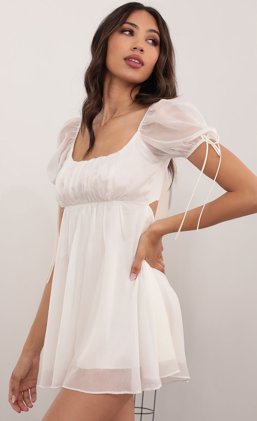 Picture Leilani Chiffon Shimmer Baby Doll Dress in White. Source: https://media.lucyinthesky.com/data/Apr21_2/850xAUTO/AT2A5524.JPG