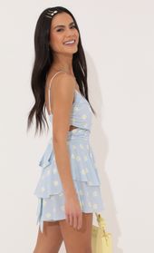 Picture thumb Shelby Ruffle Baby Doll Romper in Blue Daisy. Source: https://media.lucyinthesky.com/data/Apr22_1/170xAUTO/1V9A4674.JPG