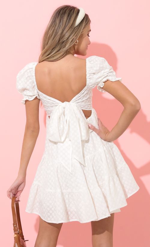 Picture Gloria Fit and Flare Dress in Floral White. Source: https://media.lucyinthesky.com/data/Apr22_1/500xAUTO/1V9A8683.JPG