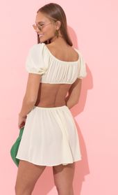 Picture thumb Veda Open Back Dress in Ivory. Source: https://media.lucyinthesky.com/data/Apr22_2/170xAUTO/1V9A2784.JPG