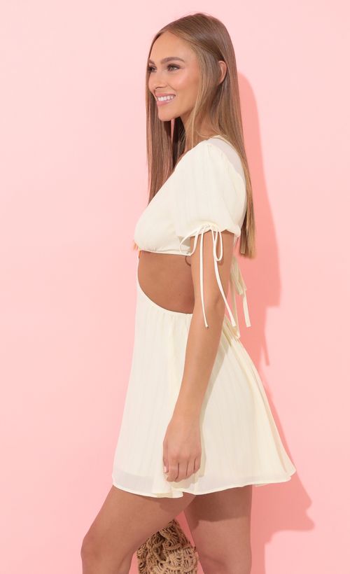 Picture Kilan Cutout Dress in Ivory. Source: https://media.lucyinthesky.com/data/Apr22_2/500xAUTO/1V9A1251.JPG