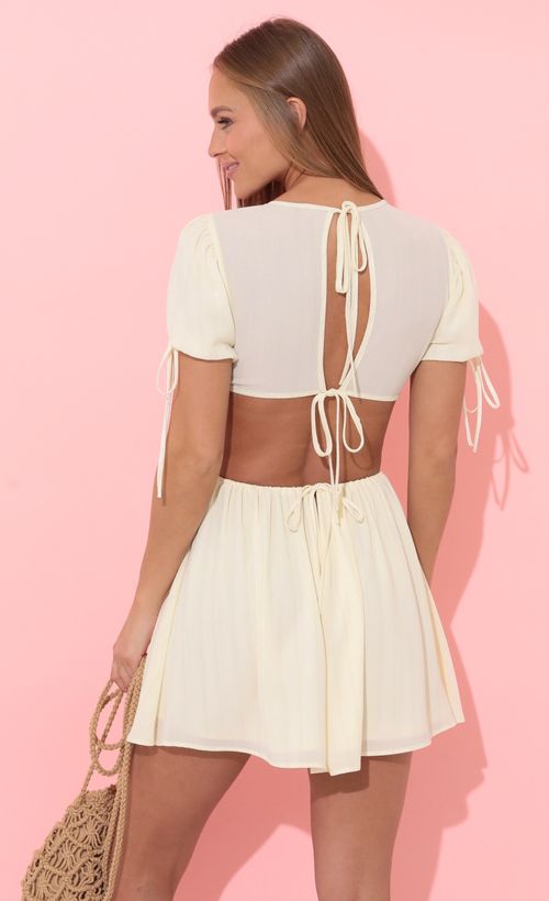 Picture Kilan Cutout Dress in Ivory. Source: https://media.lucyinthesky.com/data/Apr22_2/500xAUTO/1V9A1283.JPG