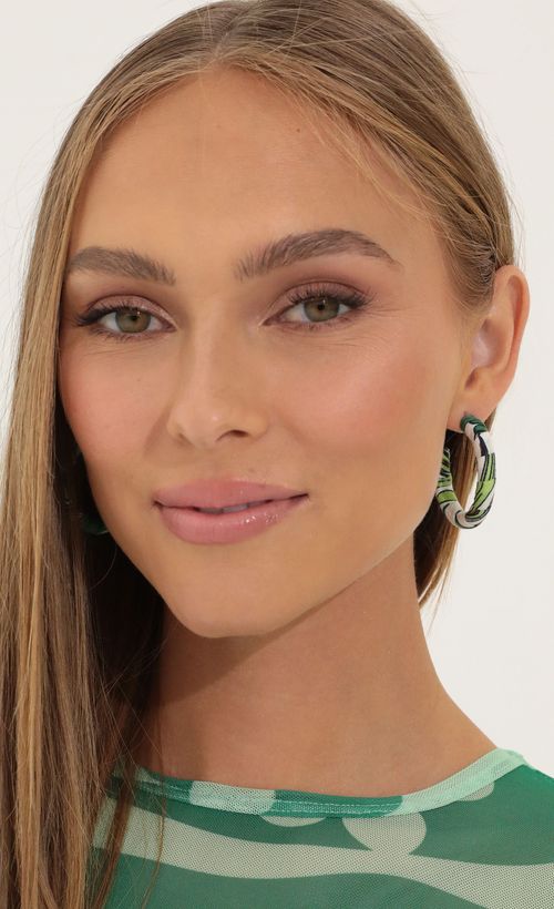 Picture Out of the Loop Hoop Earrings in Green. Source: https://media.lucyinthesky.com/data/Apr22_2/500xAUTO/1V9A32051.JPG