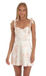 Picture Neila Satin Floral Dress in White. Source: https://media.lucyinthesky.com/data/Apr23/150xAUTO/2d1f5af0-1292-4185-908f-88aabf1efe6a.jpg