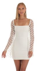 Picture Korra Mesh Sequin Flare Sleeve Dress in Black. Source: https://media.lucyinthesky.com/data/Apr23/150xAUTO/e5d85a20-0a07-4770-bd8f-751328d0a49a.jpg