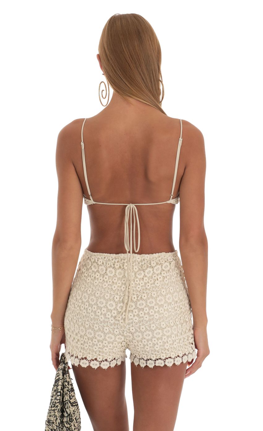Picture Andra Crochet Romper in Beige. Source: https://media.lucyinthesky.com/data/Apr23/850xAUTO/052c9fe0-a2dd-45a6-8575-a028c935975d.jpg