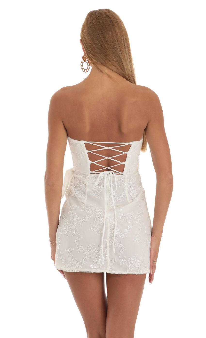 Picture Garnet Sequin Strapless Wrap Dress in White. Source: https://media.lucyinthesky.com/data/Apr23/850xAUTO/59c17c62-d0e4-47bd-ba82-d08b931241bb.jpg