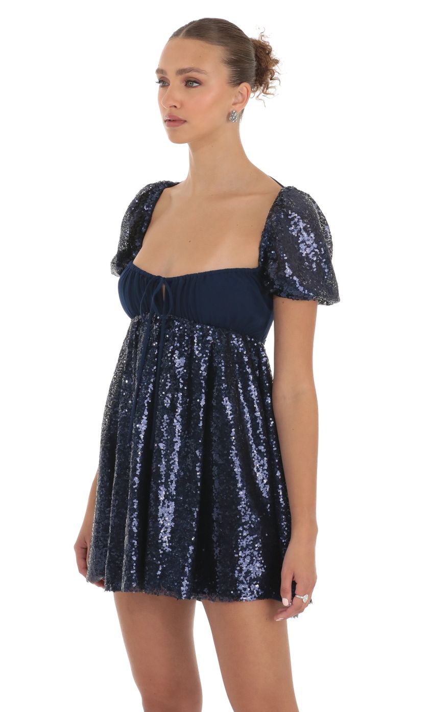 Picture Hana Sequin Puff Sleeve Baby Doll Dress in Navy. Source: https://media.lucyinthesky.com/data/Apr23/850xAUTO/83e5b454-7d9b-4986-a211-7c1951df9abc.jpg