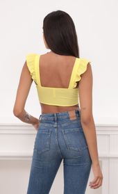 Picture thumb Carolina Ruffle Tie Crop Top in Yellow. Source: https://media.lucyinthesky.com/data/Aug20_1/170xAUTO/781A9182.JPG