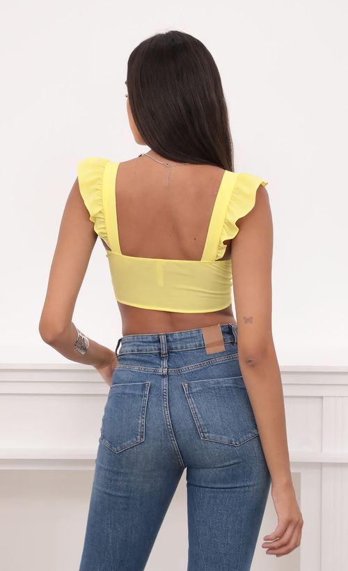 Picture Carolina Ruffle Tie Crop Top in Yellow. Source: https://media.lucyinthesky.com/data/Aug20_1/500xAUTO/781A9182.JPG