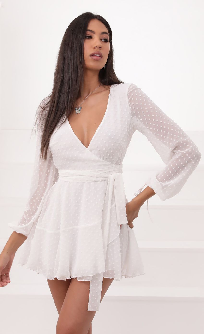 Picture Lexi Ruffle Wrap Dress in Ivory Dotted Chiffon. Source: https://media.lucyinthesky.com/data/Aug20_1/850xAUTO/781A8341.JPG