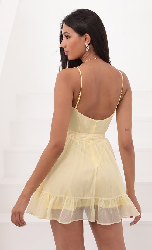 Picture Molly Ruffled Chiffon Dress in Baby Yellow. Source: https://media.lucyinthesky.com/data/Aug20_2/500xAUTO/781A2973.JPG