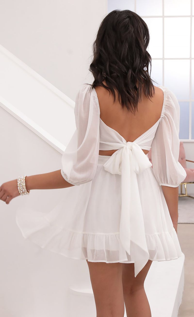 Picture Neia Ruffle Dress in White Sparkly Chiffon. Source: https://media.lucyinthesky.com/data/Aug20_2/800xAUTO/781A0203.JPG