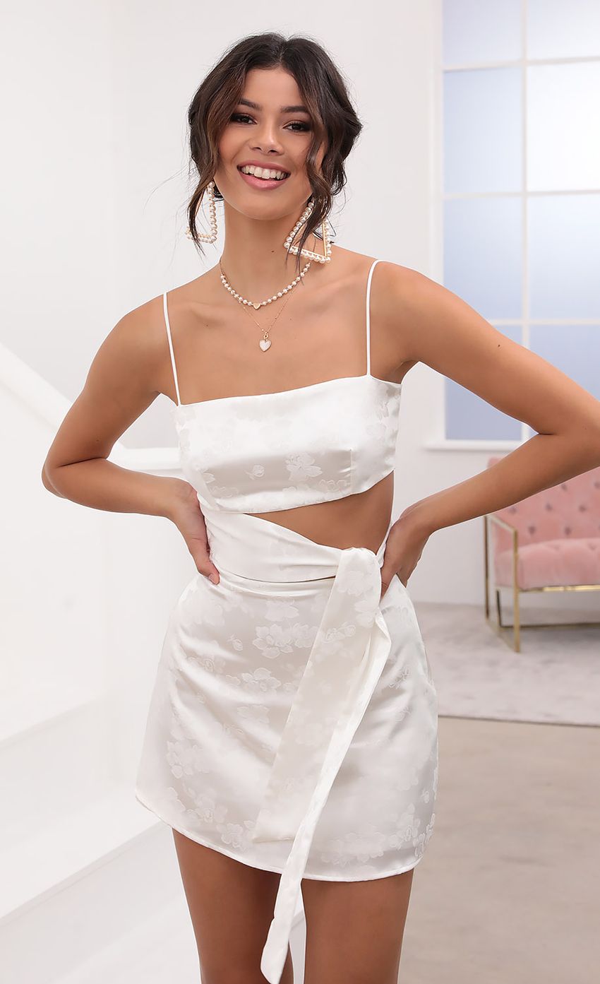 Picture Betsy Cutout Tie Dress in White Satin. Source: https://media.lucyinthesky.com/data/Aug20_2/850xAUTO/781A7121.JPG