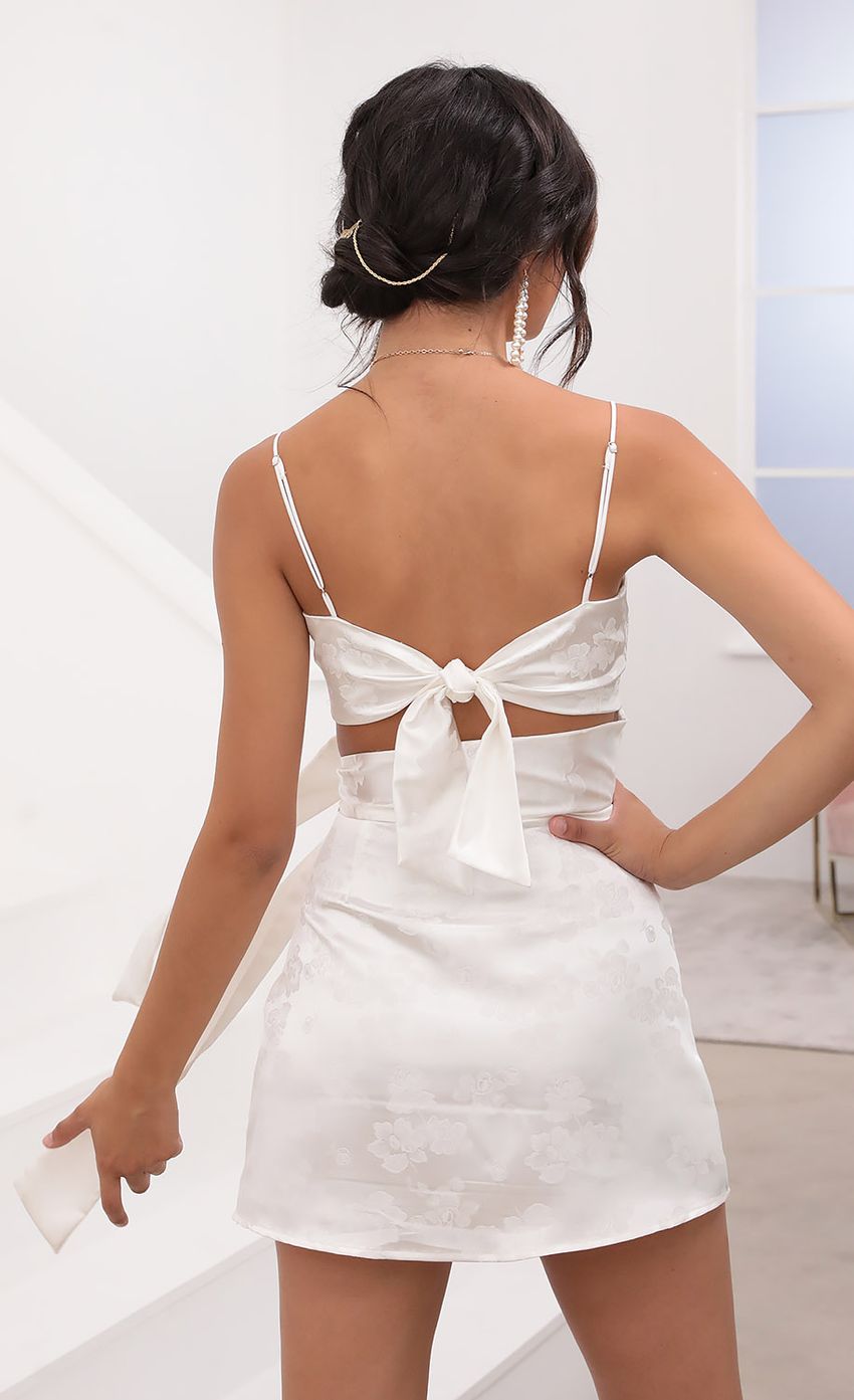 Picture Betsy Cutout Tie Dress in White Satin. Source: https://media.lucyinthesky.com/data/Aug20_2/850xAUTO/781A7213.JPG