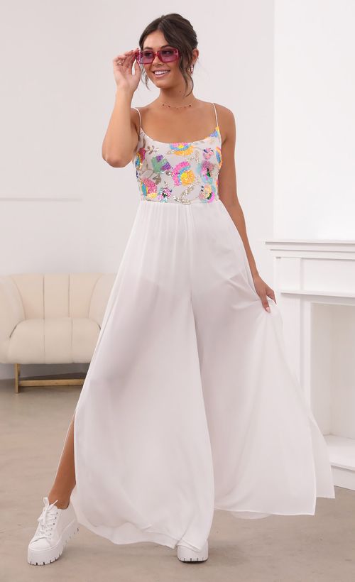 Picture Millie Multicolor Sequin Jumpsuit in White. Source: https://media.lucyinthesky.com/data/Aug21_1/500xAUTO/1V9A6410.JPG