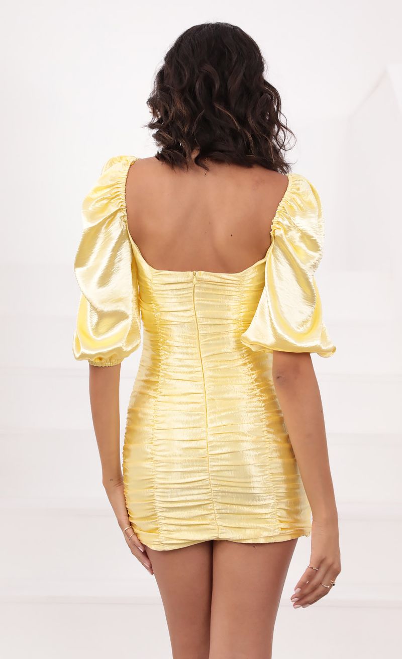 Picture Belle of The Ball Satin Dress in Yellow. Source: https://media.lucyinthesky.com/data/Aug21_2/800xAUTO/1V9A1056.JPG
