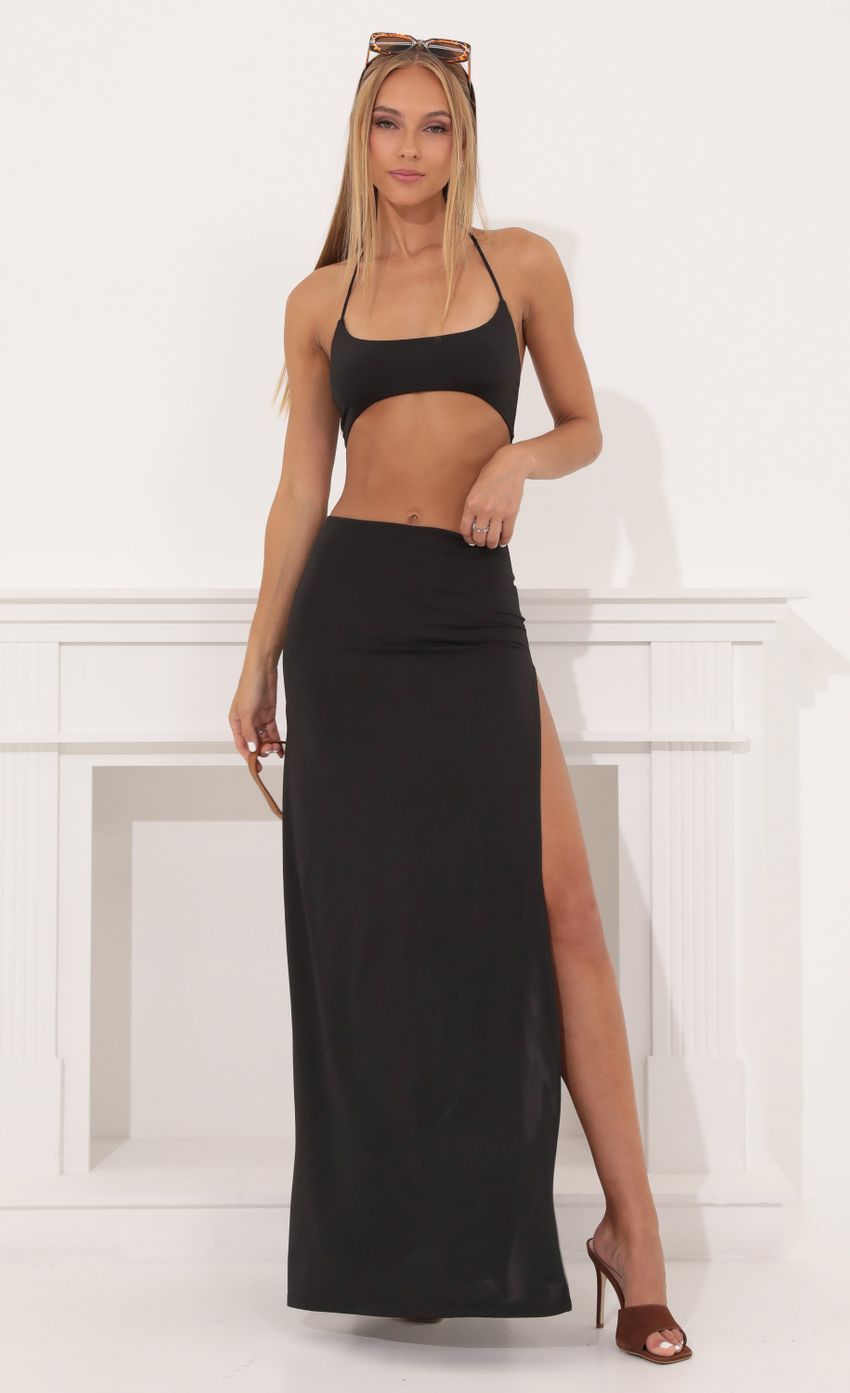 Picture Jules Tummy Cutout Maxi Dress in Black. Source: https://media.lucyinthesky.com/data/Aug22/850xAUTO/59ea12c6-04fc-406e-975c-17d1dfb3d9d0.jpg