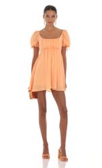 Picture Leilani Baby Doll Dress in Orange. Source: https://media.lucyinthesky.com/data/Aug23/150xAUTO/13a60cda-2942-4ffe-be6a-efe77a738c38.jpg