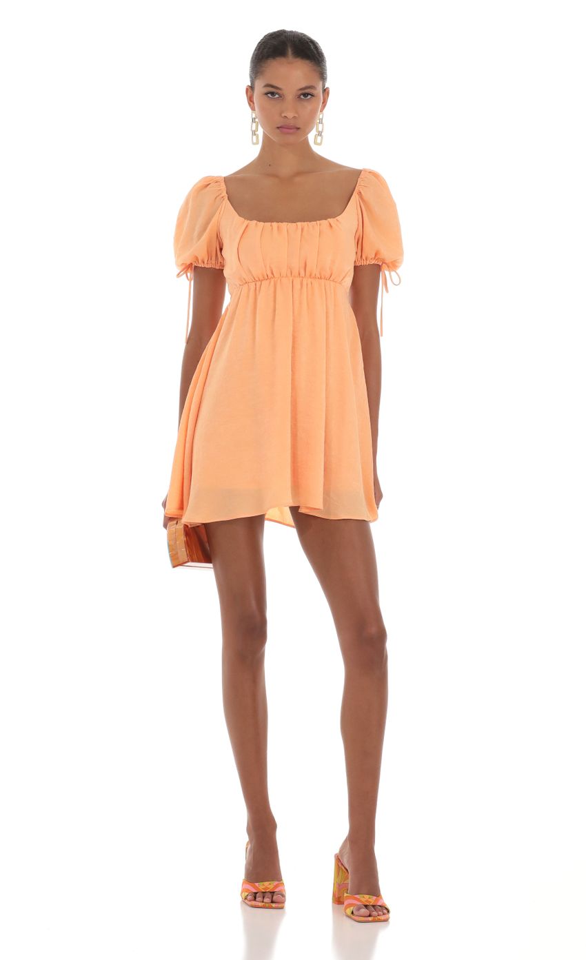 Picture Leilani Baby Doll Dress in Orange. Source: https://media.lucyinthesky.com/data/Aug23/850xAUTO/13a60cda-2942-4ffe-be6a-efe77a738c38.jpg