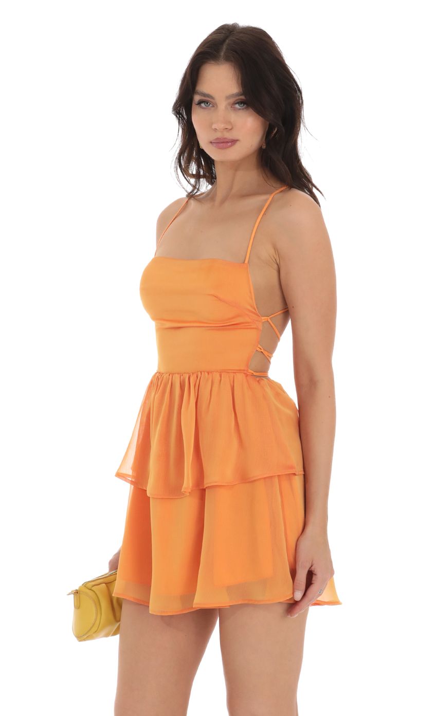 Picture Aspen Chiffon Lace Up Dress in Orange. Source: https://media.lucyinthesky.com/data/Aug23/850xAUTO/292f813c-774e-4324-ac56-29e54ef4f203.jpg
