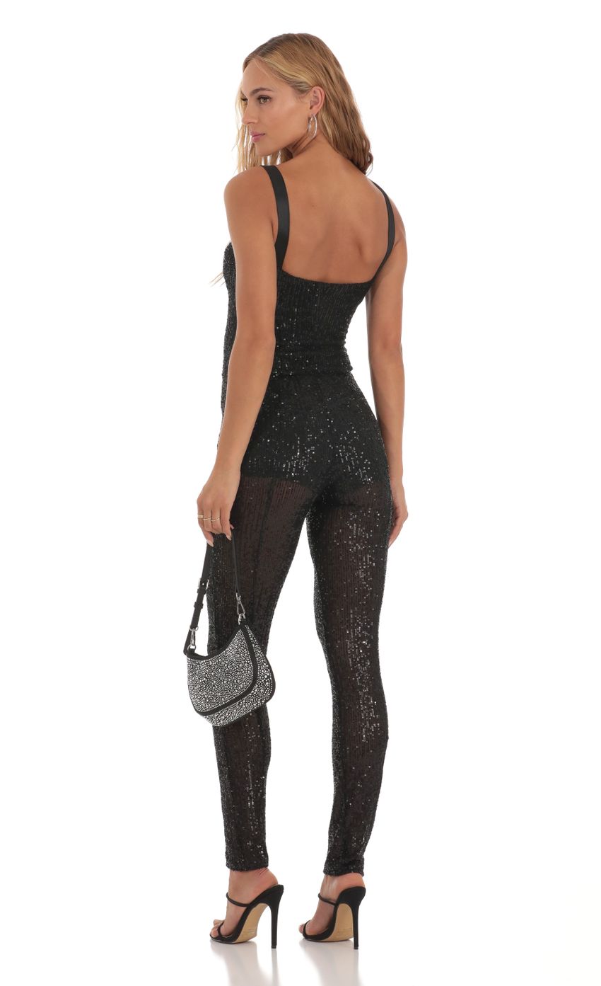 Picture Andromeda Sequin Jumpsuit in Black. Source: https://media.lucyinthesky.com/data/Aug23/850xAUTO/464a525b-4138-4fe1-92d7-5fe6842a0dce.jpg
