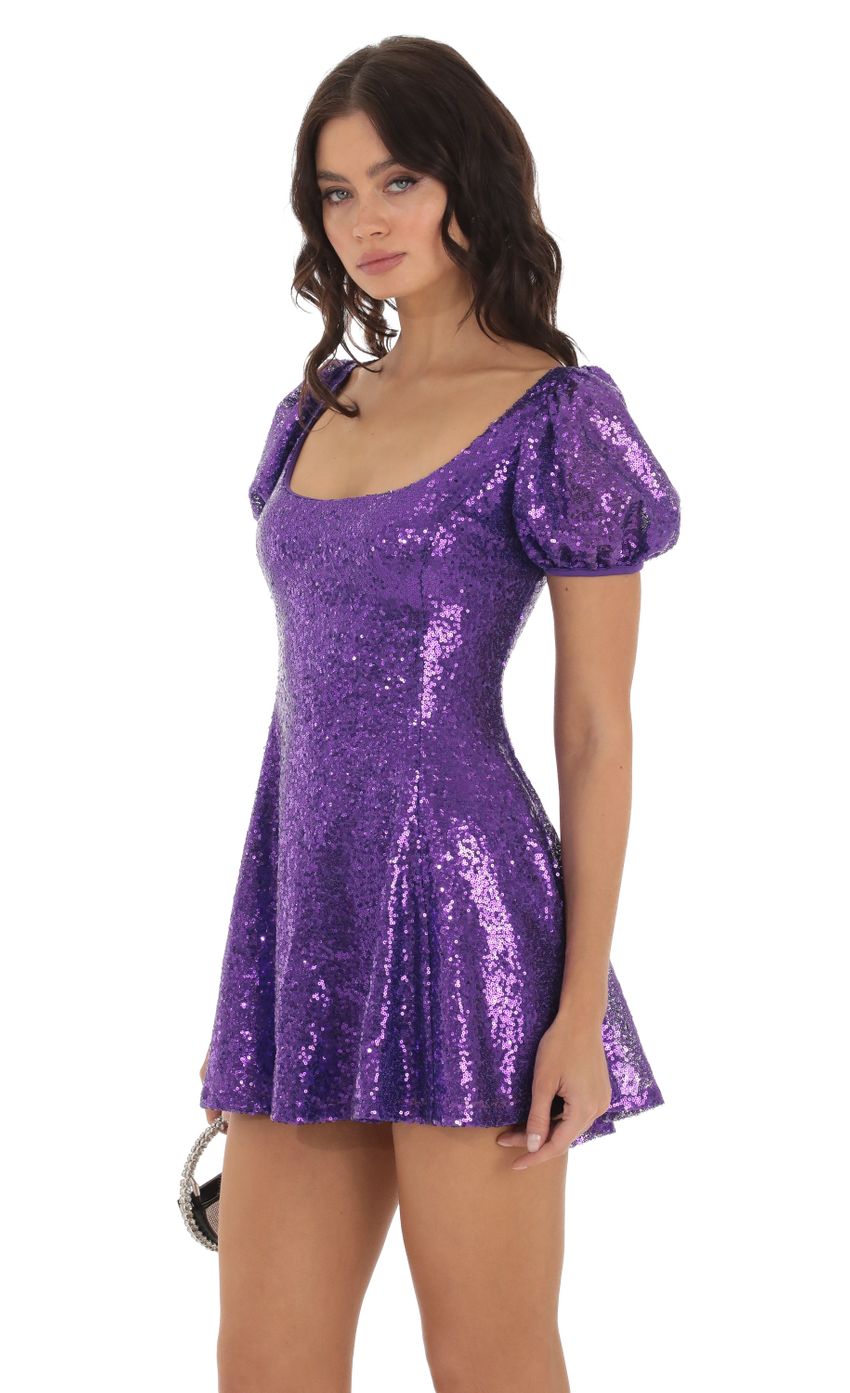 Picture Wannda Sequin Puff Sleeve Dress in Purple. Source: https://media.lucyinthesky.com/data/Aug23/850xAUTO/be7eaf55-f6b5-4776-8aef-c60d83240f74.jpg
