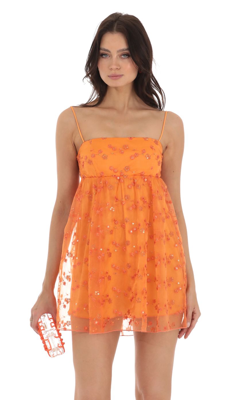 Picture Juno Sequin Floral Baby Doll Dress in Orange. Source: https://media.lucyinthesky.com/data/Aug23/850xAUTO/c5307e55-f5a8-425c-a8b9-8471e72cb238.jpg
