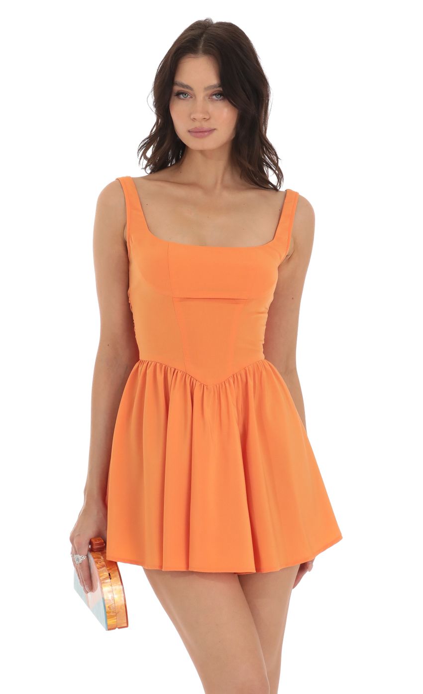 Picture Indiana Mini Dress in Orange. Source: https://media.lucyinthesky.com/data/Aug23/850xAUTO/d43021bf-2efb-44ab-b4e3-24bf06a6eb96.jpg