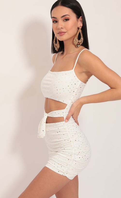Picture Daytona Twinkling Cutout Dress in Ivory Gold. Source: https://media.lucyinthesky.com/data/Dec19_1/500xAUTO/781A0865.JPG