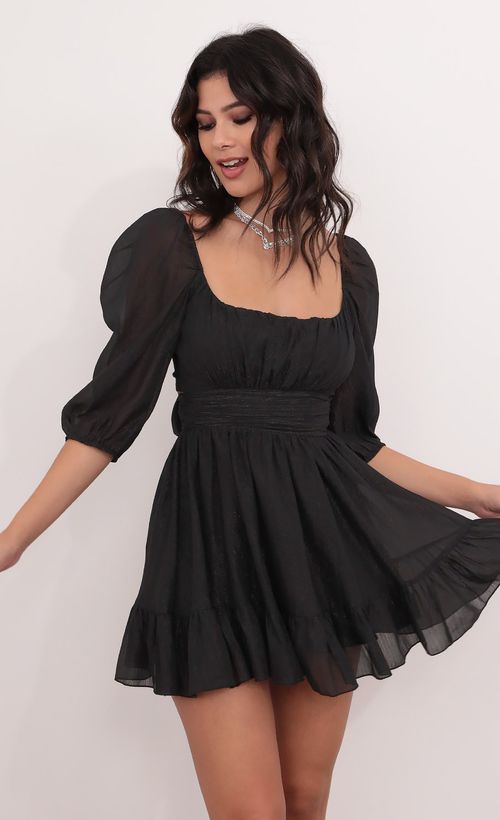 Picture Neia Ruffle Dress in Black Shimmer. Source: https://media.lucyinthesky.com/data/Dec20_1/500xAUTO/1V9A0228.JPG