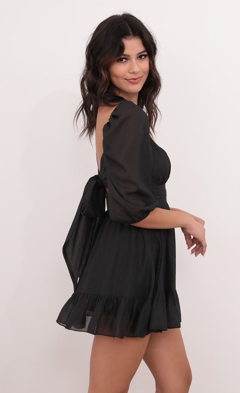 Picture Neia Ruffle Dress in Black Shimmer. Source: https://media.lucyinthesky.com/data/Dec20_1/800xAUTO/1V9A0190.JPG