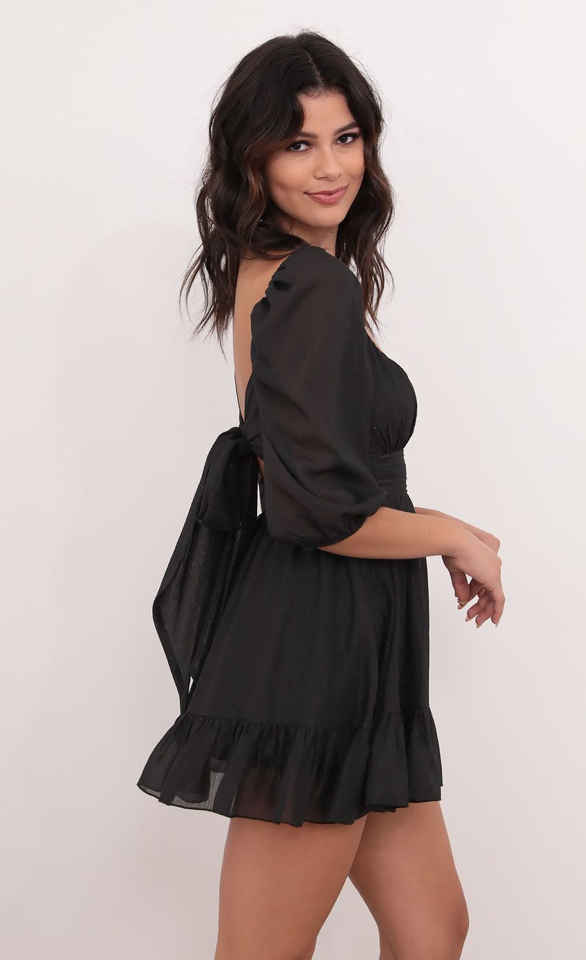 Picture Neia Ruffle Dress in Black Shimmer. Source: https://media.lucyinthesky.com/data/Dec20_1/850xAUTO/1V9A0190.JPG