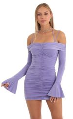 Picture Ottilie Ruched Bodycon Flare Sleeve Dress in Purple. Source: https://media.lucyinthesky.com/data/Dec22/150xAUTO/2cd977ce-d07c-4ce7-9f51-e057bb0553de.jpg