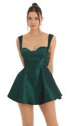 Picture Kassidy Sequin Bust A-Line Dress in Green. Source: https://media.lucyinthesky.com/data/Dec22/150xAUTO/6749a7c1-dcf0-40fd-86a1-91057911ab05.jpg
