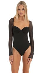 Picture Evonne Glitter Mesh Long Sleeve Bodysuit in Black. Source: https://media.lucyinthesky.com/data/Dec22/150xAUTO/85ea0321-ac22-4ef3-86f0-9fd9622a5594.jpg