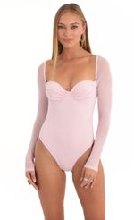 Picture Evonne Glitter Mesh Long Sleeve Bodysuit in Pink. Source: https://media.lucyinthesky.com/data/Dec22/150xAUTO/91763d6b-51fa-459b-9b2c-1af4fae8641e.jpg