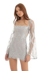 Picture Vida Sequin Flare Sleve Dress in Silver. Source: https://media.lucyinthesky.com/data/Dec22/150xAUTO/cd6a4cfe-7103-4a28-92a3-1903f75ed588.jpg