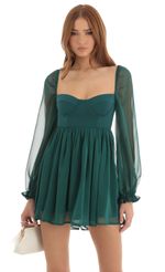 Picture Murphy Corset Long Sleeve Dress in Green. Source: https://media.lucyinthesky.com/data/Dec22/150xAUTO/ea718e6f-c6df-436f-b87f-08922a0ddd57.jpg