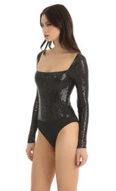 Picture thumb Aislin Sequin Long Sleeve Bodysuit in Black. Source: https://media.lucyinthesky.com/data/Dec22/170xAUTO/2e5484ef-5866-430a-8785-e8b24a3075bf.jpg