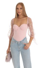 Picture thumb Adrianna Sequin Puff Sleeve Bodysuit in Pink. Source: https://media.lucyinthesky.com/data/Dec22/170xAUTO/5e83f807-bf57-4c7e-941e-239f7d0264fb.jpg